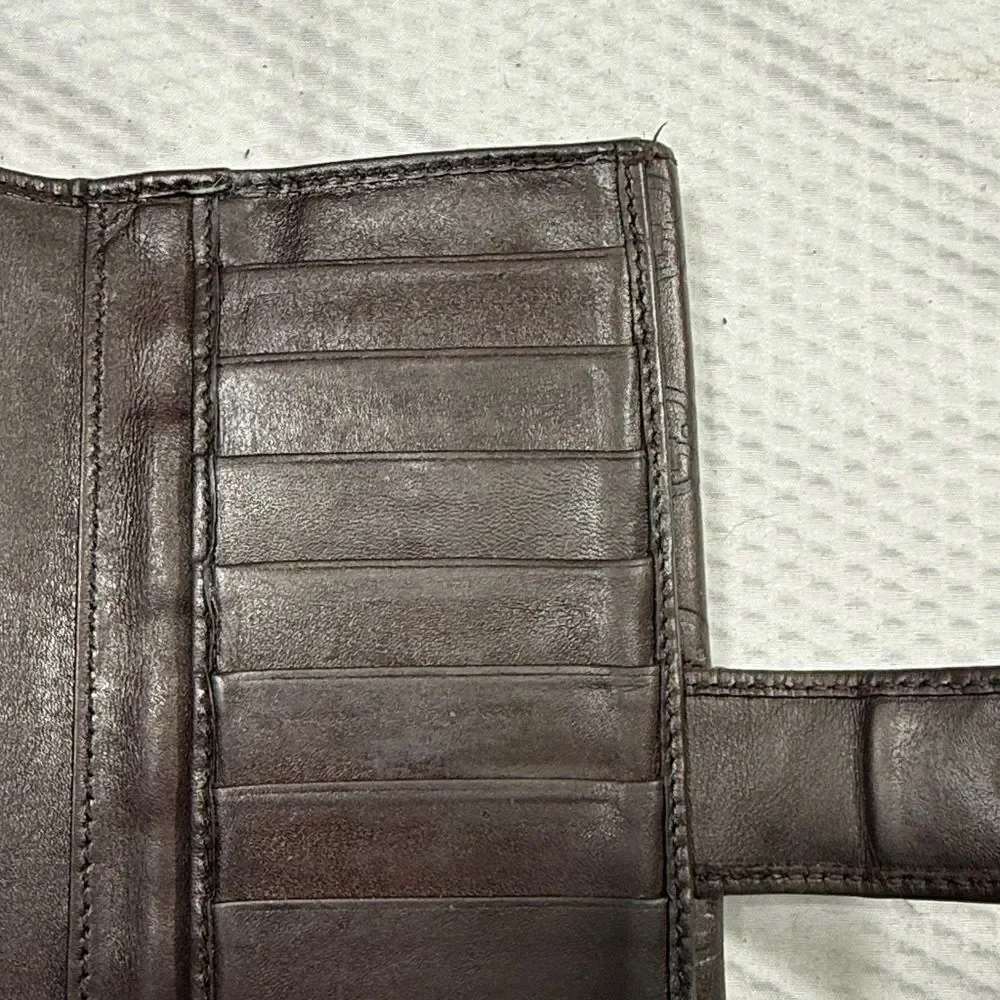 Gucci Dark Brown Embossed Clutch wallet inside is clean. GUC much life left!